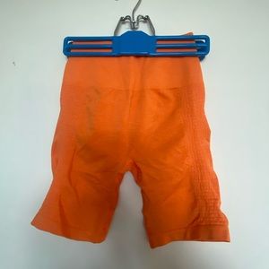 Alphalete- Biker Shorts, Creamsicle Orange (small)